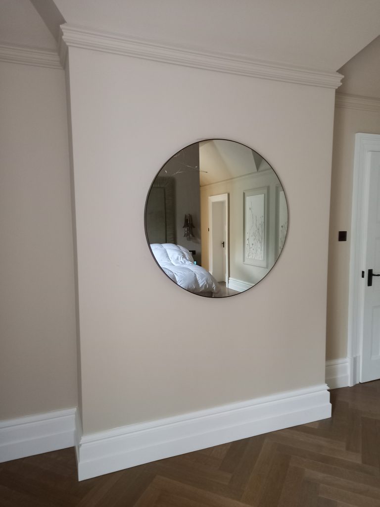 Round Bathroom Mirror TV with Brass Frame in bedroom